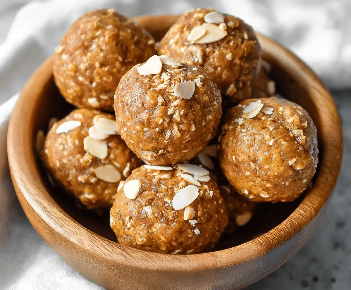 Delicious almond butter pumpkin protein balls on a white plate, showcasing a healthy, energy-boosting snack with almonds and pumpkin puree.
