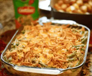 Delicious green bean casserole topped with crispy potatoes, perfect for holiday dinners.