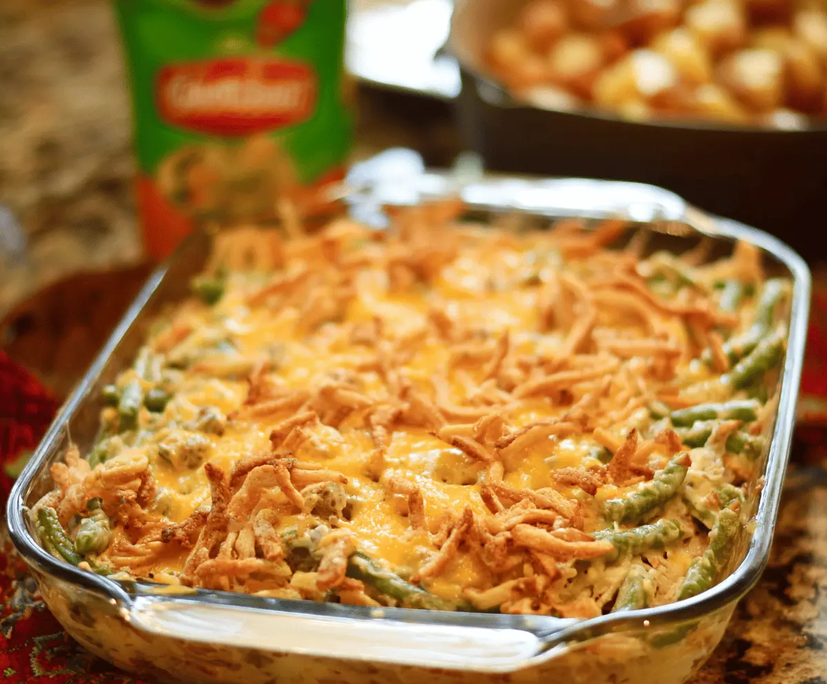 Delicious green bean casserole topped with crispy potatoes, perfect for holiday dinners.