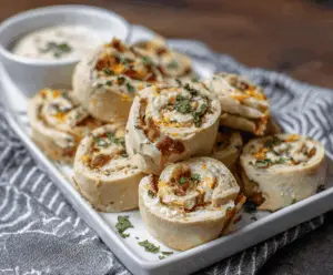 Delicious Chicken Bacon Ranch Pinwheels sliced to reveal cheesy filling with crispy bacon and tender chicken.