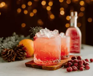 Festive Christmas Paloma cocktail served in a decorative glass with garnishes.