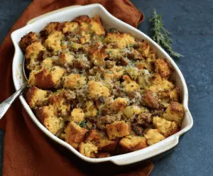 Delicious sausage and herb stuffing with golden-brown top, perfect for holiday dinners.