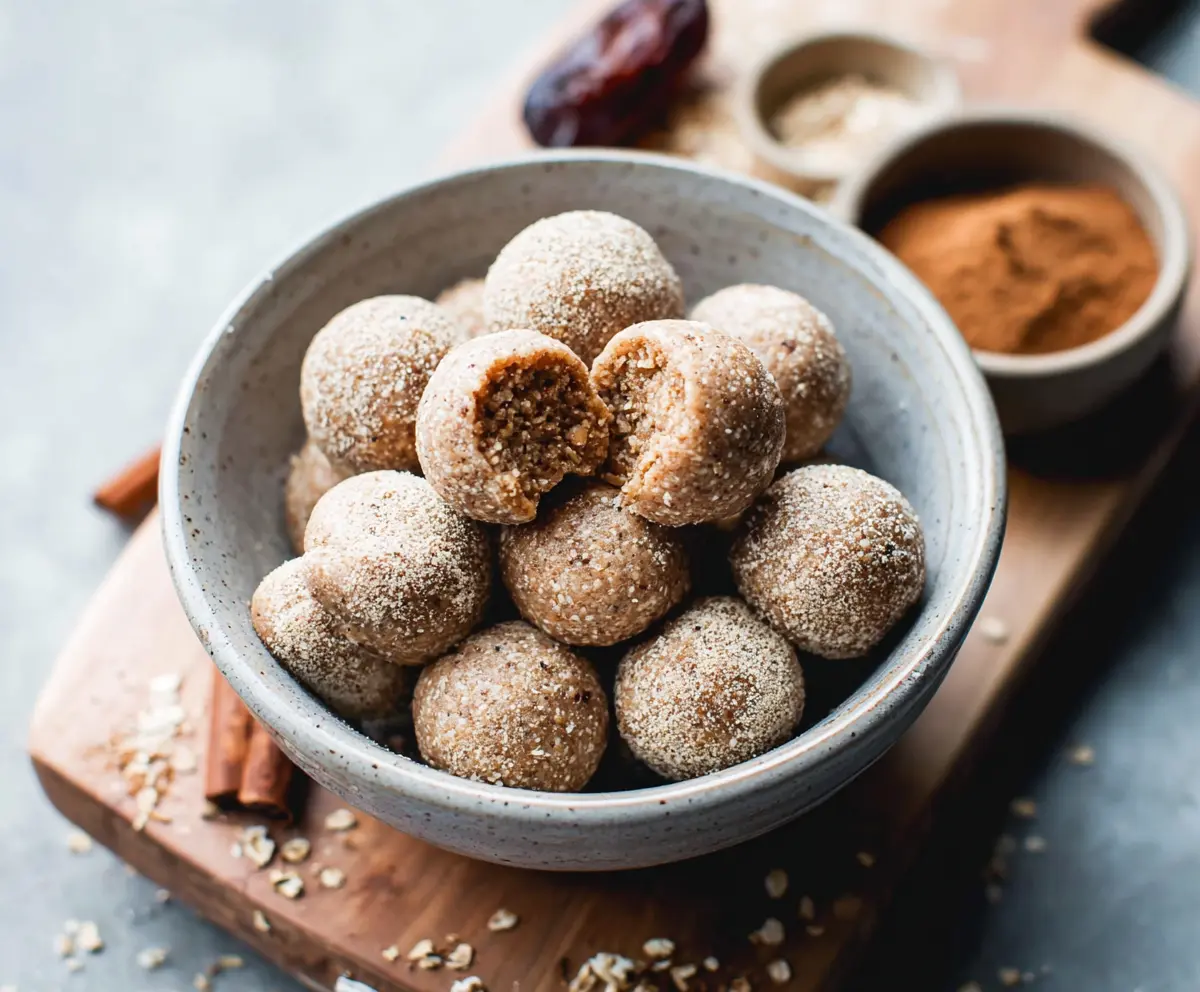 Delicious Cinnamon Roll Energy Bites with swirls of cinnamon and icing, perfect for a quick snack.