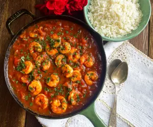 Delicious Louisiana Shrimp Creole served in a bowl with fresh herbs and spices