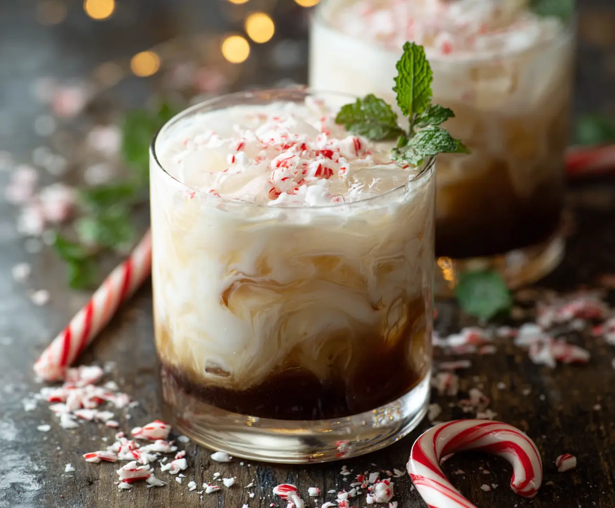 Delicious Peppermint White Russian cocktail garnished with peppermint and whipped cream.