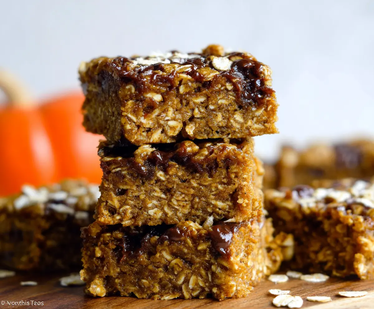 Delicious homemade Pumpkin Oatmeal Bars with a crumbly topping and kernels of pumpkin