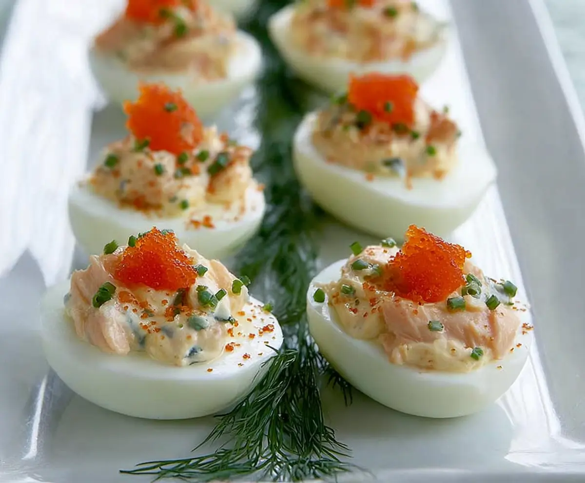 Delicious smoked salmon stuffed eggs with creamy filling garnished with herbs