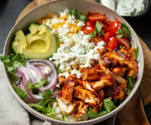 Delicious BBQ Chicken Cottage Cheese Bowl featuring grilled chicken, cottage cheese, fresh vegetables, and savory BBQ sauce.