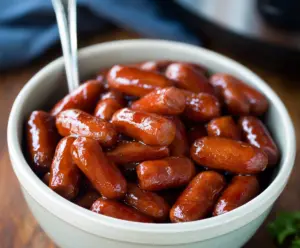 Delicious Crock Pot Little Smokies served in a bowl with toothpicks for easy snacking