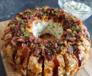 Delicious Bacon Cheese Ring Party Dip served on a platter, perfect for gatherings.