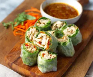 Delicious Bang Bang Chicken Rice Paper Rolls with fresh vegetables and creamy sauce