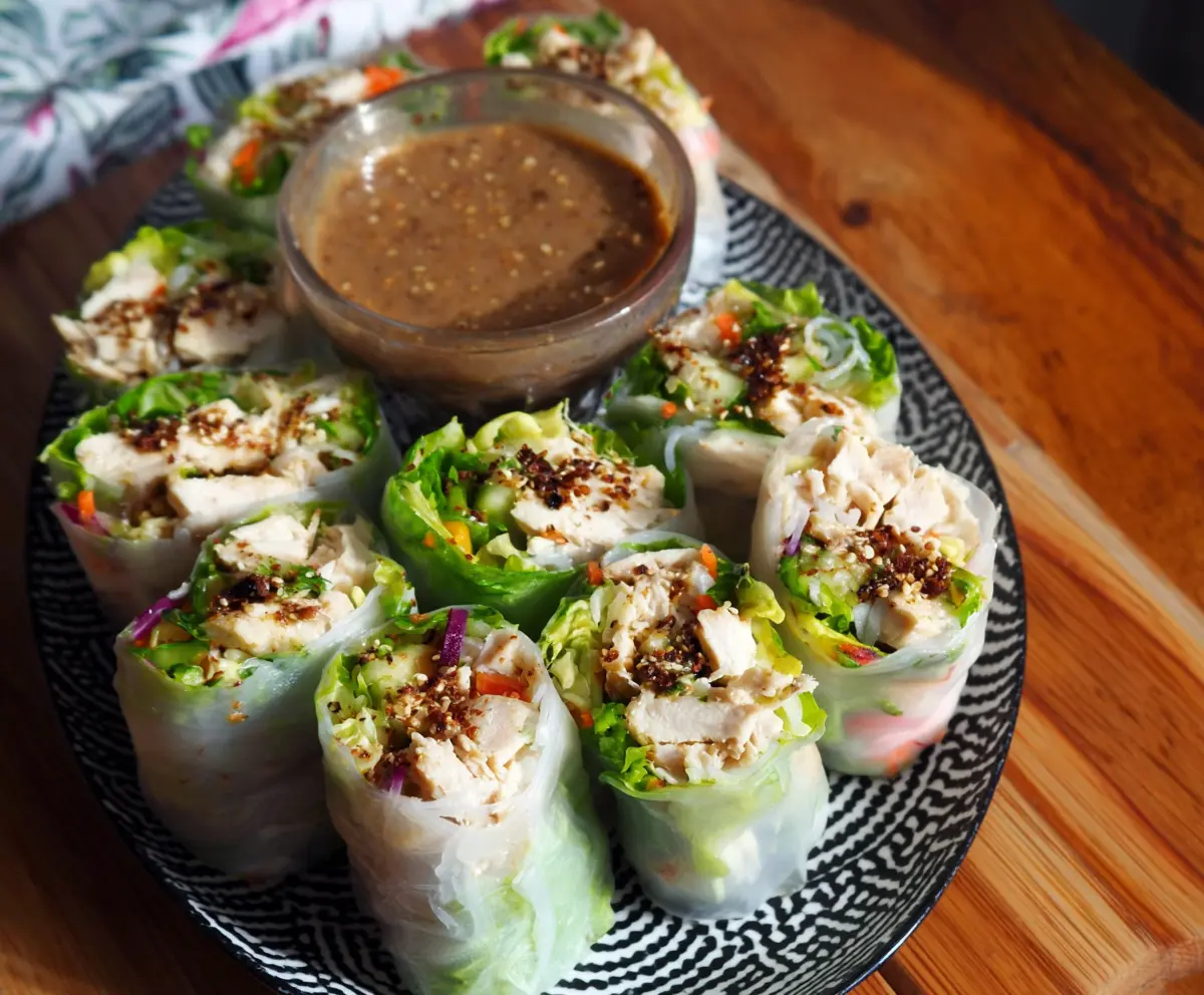 Delicious Caesar Chicken Rice Paper Rolls with fresh greens and creamy dressing.