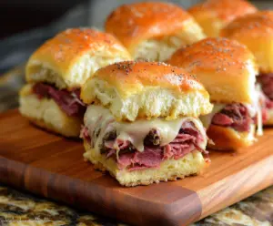 Delicious corned beef sliders with melted cheese and pickles on soft buns
