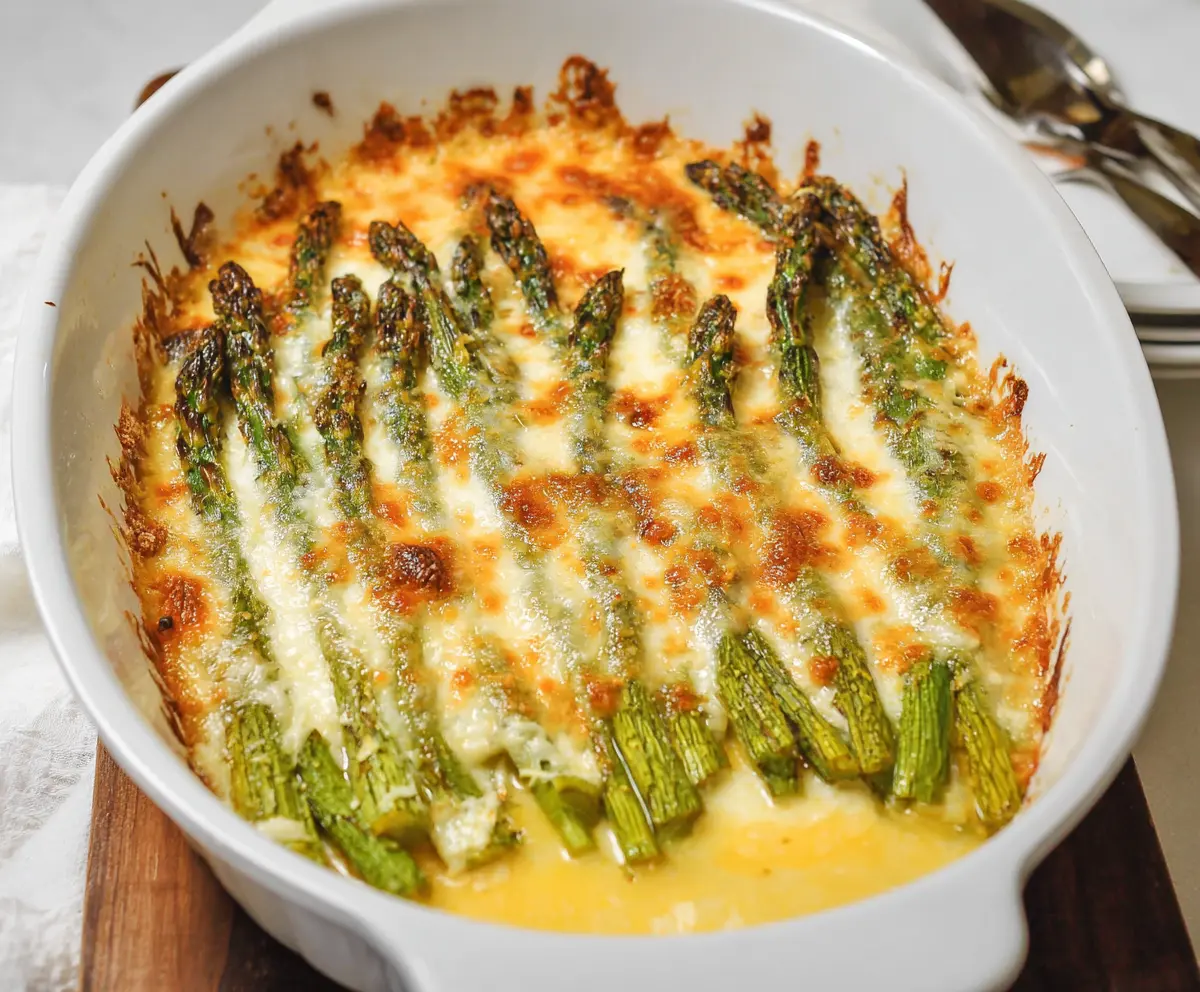 Delicious Cheesy Asparagus Bake with melted cheese and tender asparagus, perfect for a healthy appetizer or side dish.